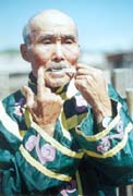 The Hezhe Old Man Playing a Stringed Instrument by Mouth